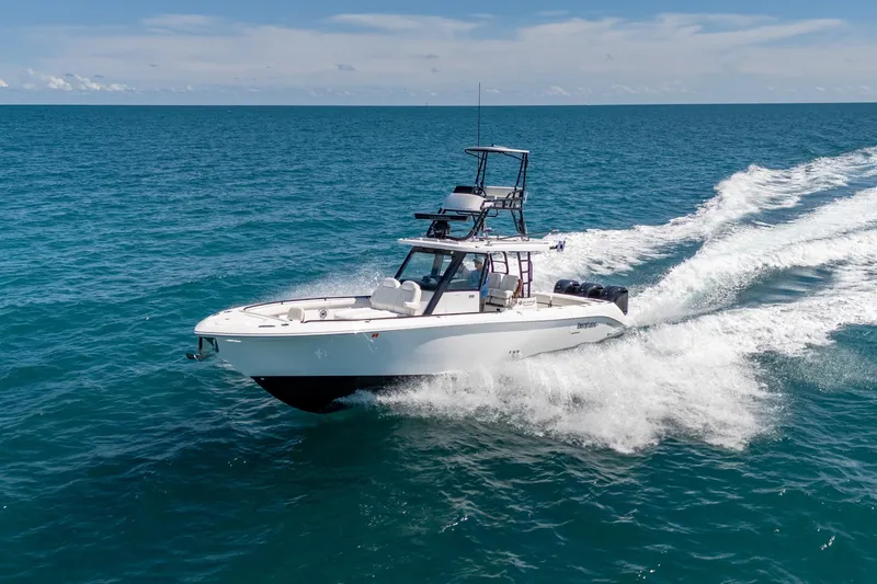 The Image of 2025 Everglades 375 Center Console boat cruising on open ocean waters. - 1