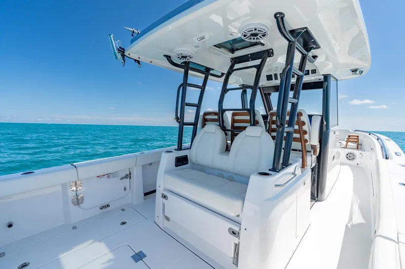 Slide: The Image of 2025 Everglades 375 Center Console boat on open sea, featuring sleek design and modern amenities. - 18