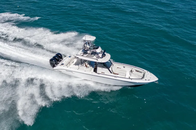 Slide: The Image of 2025 Everglades 375 Center Console boat cruising on open water. - 2