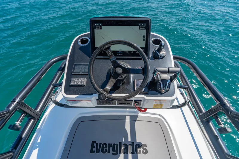 Slide: The Image of 2025 Everglades 375 Center Console helm with advanced navigation system on open water. - 23