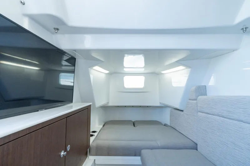 Slide: The Image of 2025 Everglades 375 Center Console cabin interior with modern design and comfortable seating. - 26