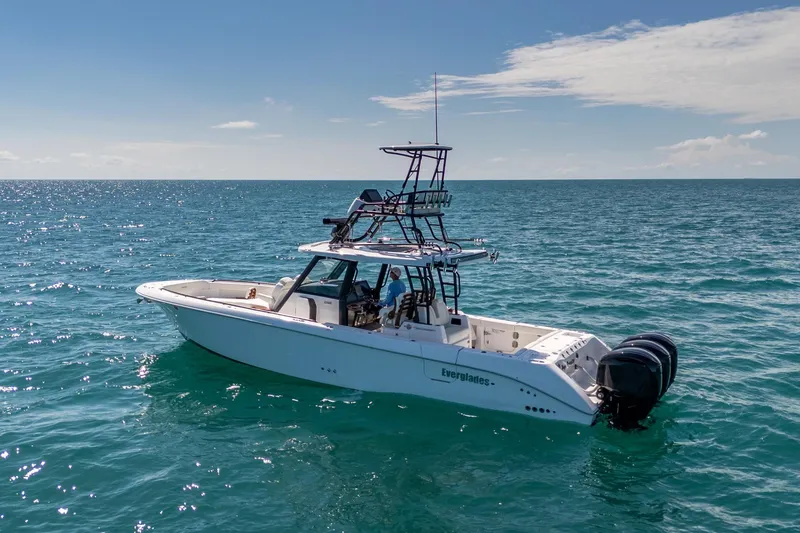 Slide: The Image of 2025 Everglades 375 Center Console boat on open ocean under clear sky. - 33