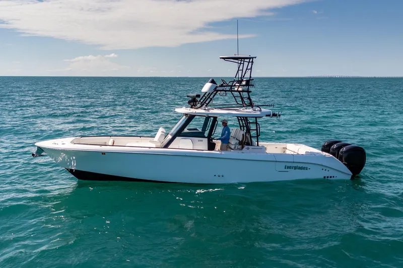 Slide: The Image of 2025 Everglades 375 Center Console boat on open sea, clear sky background. - 5