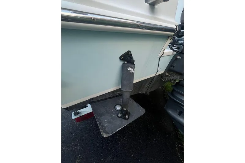 Slide: The Image of 2005 Sailfish 218 WAC boat with trim tab detail. - 11