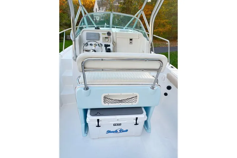 Slide: The Image of 2005 Sailfish 218 WAC boat interior with steering wheel and seating area. - 30