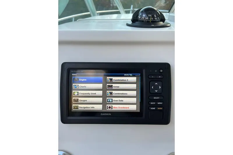 Slide: The Image of Garmin navigation system on 2005 Sailfish 218 WAC boat dashboard with compass. - 33