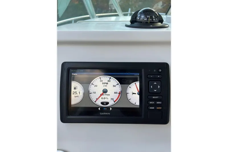 Slide: The Image of Garmin display on 2005 Sailfish 218 WAC boat showing engine RPM and fuel data. - 34