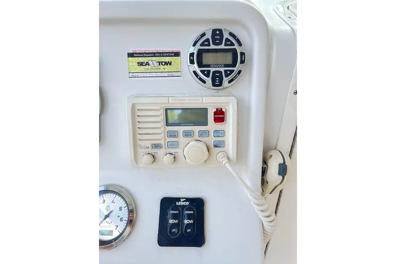 Slide: The Image of Control panel of a 2005 Sailfish 218 WAC boat with radio and gauges. - 38