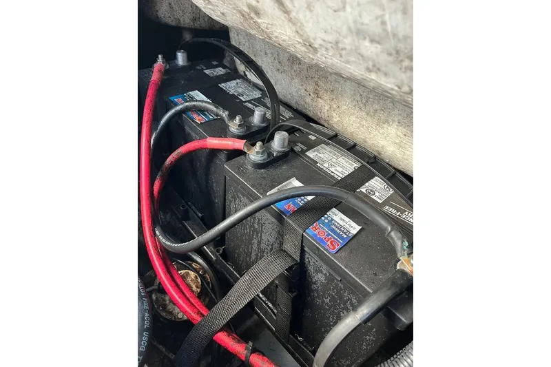 Slide: The Image of Battery compartment of a 2005 Sailfish 218 WAC boat with visible cables and connections. - 39
