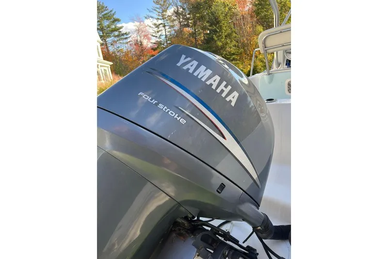 Slide: The Image of Yamaha four-stroke engine on 2005 Sailfish 218 WAC boat, surrounded by autumn trees. - 57