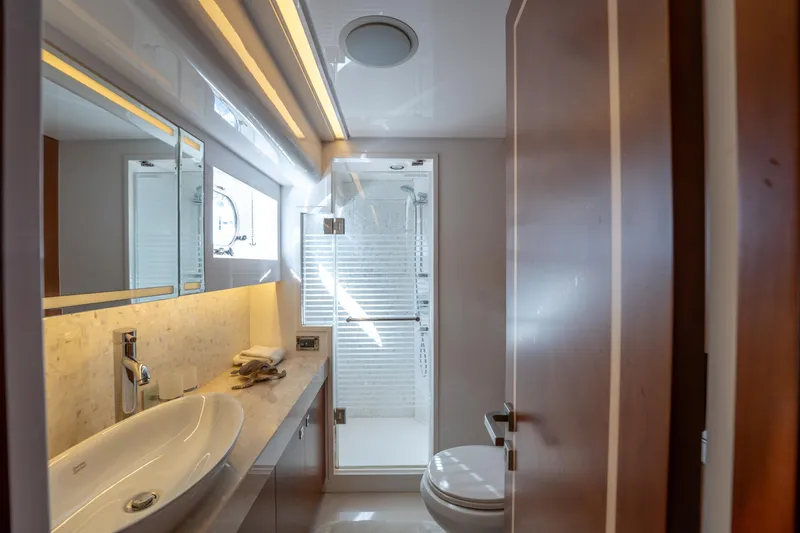 Slide: The Image of Luxurious bathroom in 2016 Horizon PC52 yacht with modern fixtures and elegant design. - 11