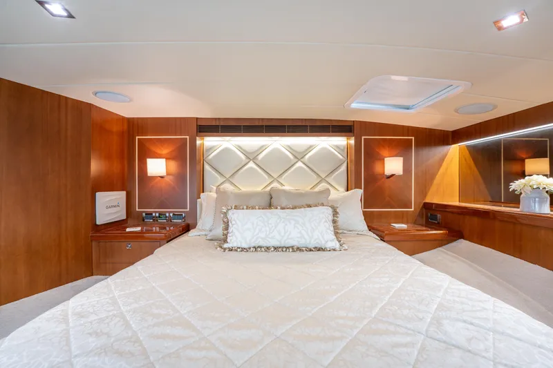 Slide: The Image of Luxurious bedroom interior of 2016 Horizon PC52 yacht with elegant wood paneling and plush bedding. - 16