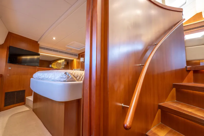 Slide: The Image of Luxurious interior of 2016 Horizon PC52 yacht with wooden staircase and cozy bedroom. - 18
