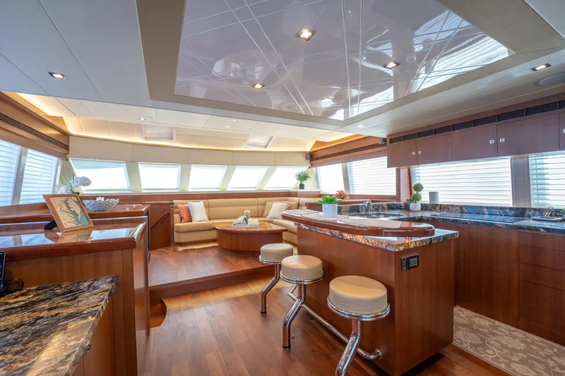 Slide: The Image of Luxurious interior of 2016 Horizon PC52 yacht with modern kitchen and seating area. - 2