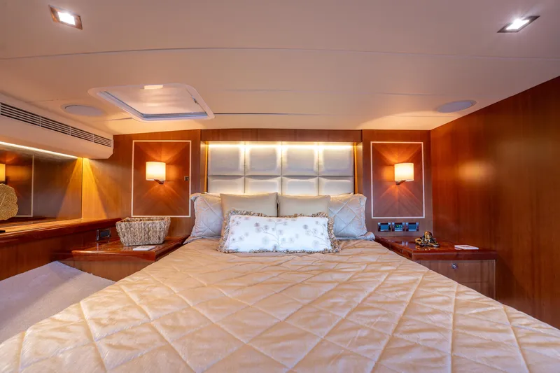 Slide: The Image of Luxurious cabin interior of 2016 Horizon PC52 yacht with elegant bedding and warm lighting. - 20