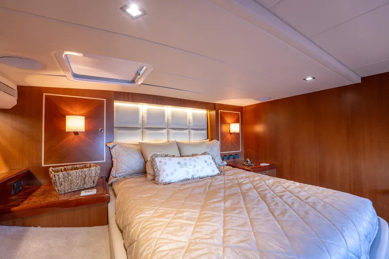 Slide: The Image of Luxurious bedroom interior of 2016 Horizon PC52 yacht with elegant lighting and plush bedding. - 21