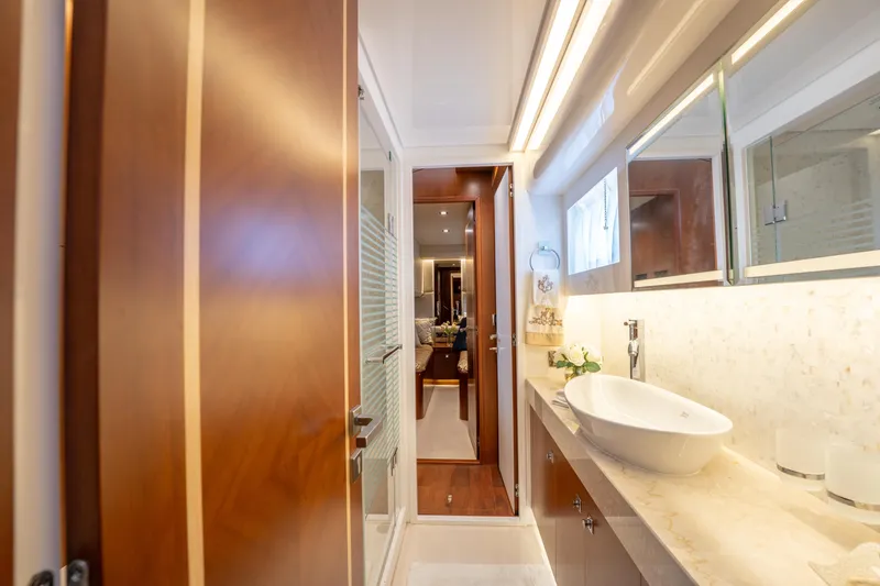 Slide: The Image of Luxurious bathroom interior on 2016 Horizon PC52 yacht with modern fixtures and elegant design. - 23