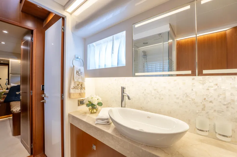 Slide: The Image of Luxurious bathroom interior on 2016 Horizon PC52 yacht with elegant sink and decor. - 24