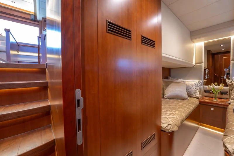 Slide: The Image of Luxurious 2016 Horizon PC52 yacht interior with wooden stairs and cozy cabin. - 27