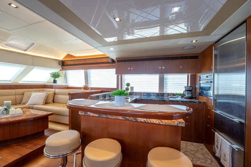 Slide: The Image of Luxurious interior of 2016 Horizon PC52 yacht with modern kitchen and seating area. - 3
