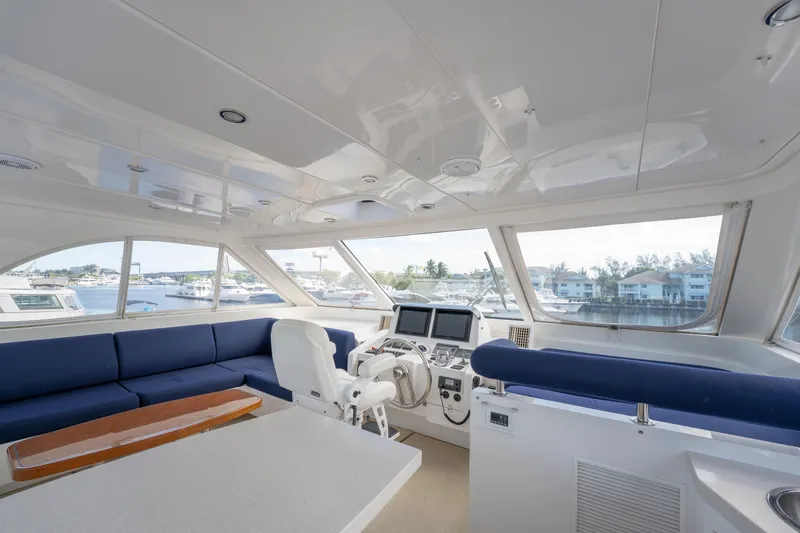 Slide: The Image of Luxurious interior of 2016 Horizon PC52 yacht with panoramic windows and modern helm. - 34