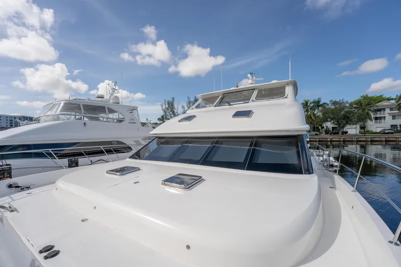 Slide: The Image of 2016 Horizon PC52 yacht docked under a clear blue sky. - 40