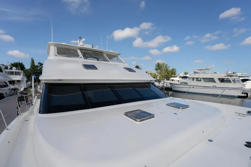 Slide: The Image of Luxury Horizon PC52 yacht docked at marina under clear blue sky, 2016 model. - 41