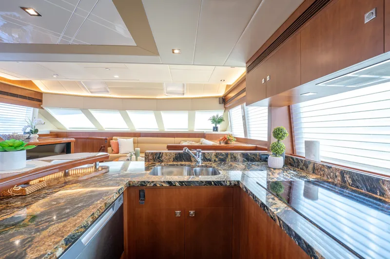Slide: The Image of Luxurious interior of 2016 Horizon PC52 yacht with elegant kitchen and seating area. - 5