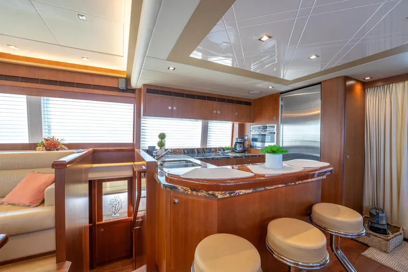 Slide: The Image of Luxurious 2016 Horizon PC52 yacht interior with modern kitchen and elegant seating area. - 6