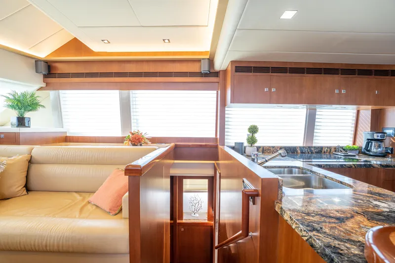 Slide: The Image of Luxurious interior of 2016 Horizon PC52 yacht with modern kitchen and seating area. - 9