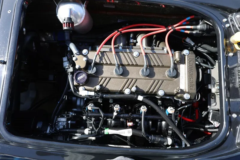 Slide: The Image of 2022 Kawasaki Jetski SX-R engine with visible wiring and components. - 13