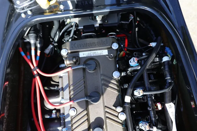 Slide: The Image of 2022 Kawasaki Jetski SX-R engine with visible wiring and components. - 15