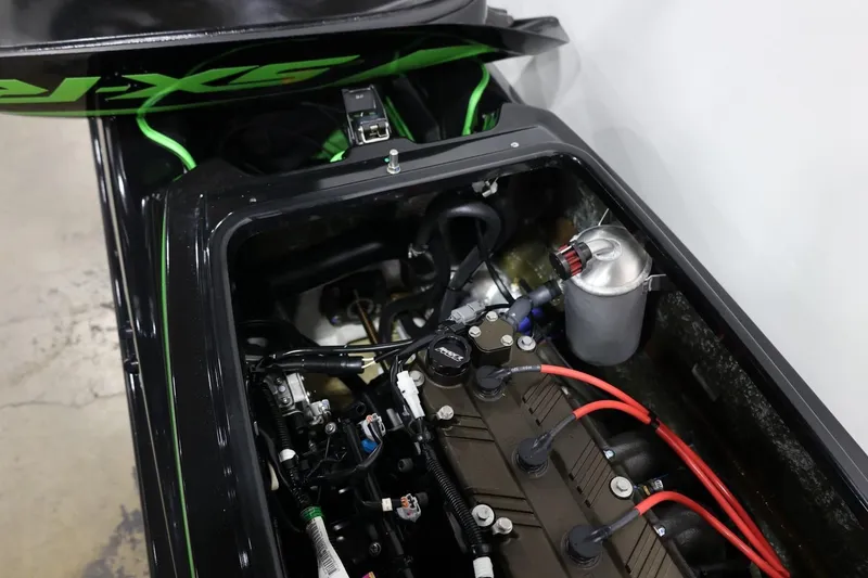Slide: The Image of 2022 Kawasaki Jetski SX-R engine compartment with visible components and wiring. - 18