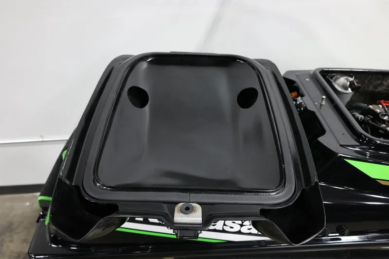 Slide: The Image of 2022 Kawasaki Jetski SX-R engine compartment, black and green design, open view. - 20