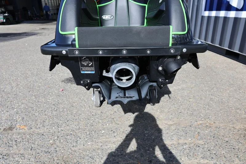 Slide: The Image of Rear view of a 2022 Kawasaki Jetski SX-R on pavement, showcasing its jet propulsion system. - 4