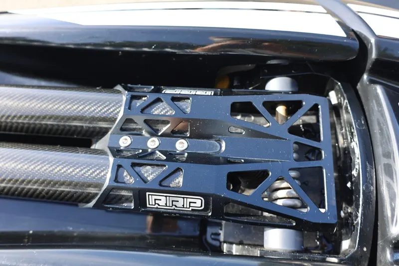 Slide: The Image of Close-up of 2022 Kawasaki Jetski SX-R engine components with carbon fiber detailing. - 8