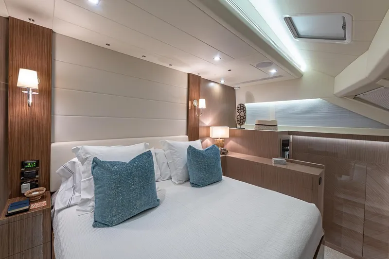 Slide: The Image of Luxurious 2023 Horizon PC60 yacht bedroom with modern decor and ambient lighting. - 11