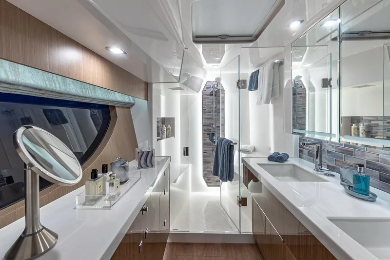 Slide: The Image of Luxurious bathroom in 2023 Horizon PC60 yacht with modern fixtures and elegant design. - 13