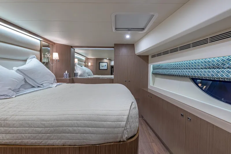 Slide: The Image of Luxurious cabin interior of 2023 Horizon PC60 yacht with elegant bedding and modern design. - 15