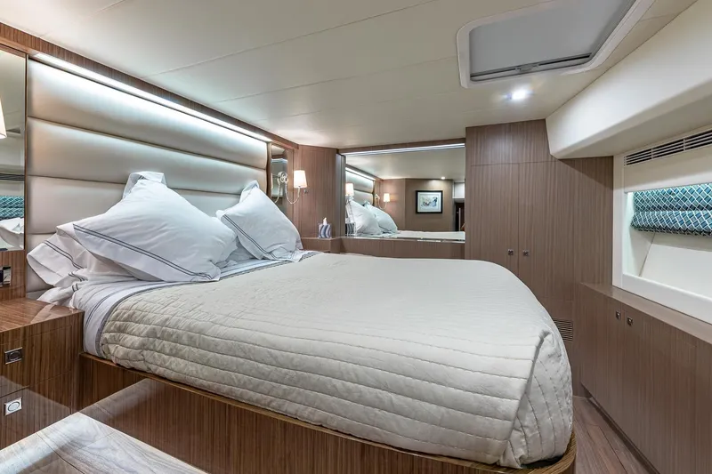 Slide: The Image of Luxurious bedroom interior of 2023 Horizon PC60 yacht with modern design and elegant bedding. - 16