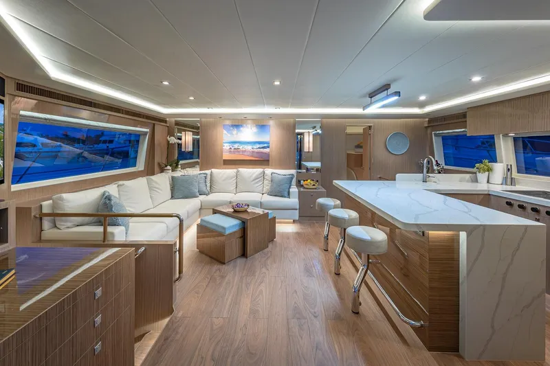Slide: The Image of Luxurious 2023 Horizon PC60 yacht interior with modern kitchen and spacious seating area. - 2