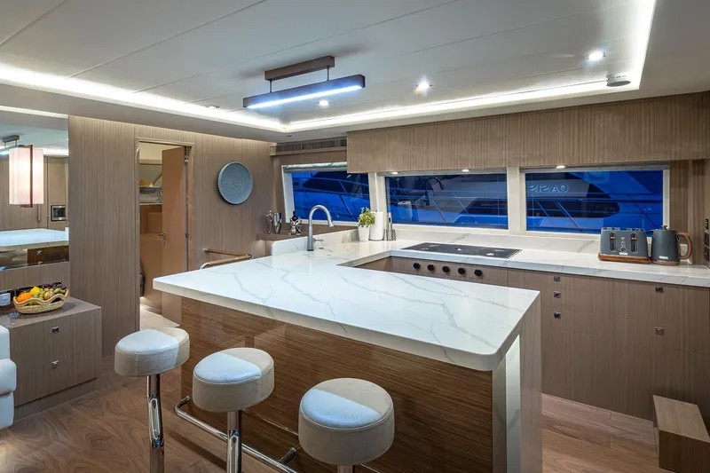 Slide: The Image of Luxurious 2023 Horizon PC60 yacht interior with modern kitchen and elegant marble countertops. - 3