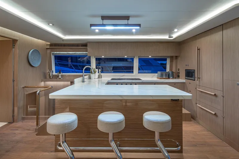 Slide: The Image of Luxurious 2023 Horizon PC60 yacht kitchen with modern design and elegant lighting. - 4