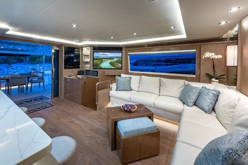 Slide: The Image of Luxurious interior of 2023 Horizon PC60 yacht with modern decor and spacious seating. - 5