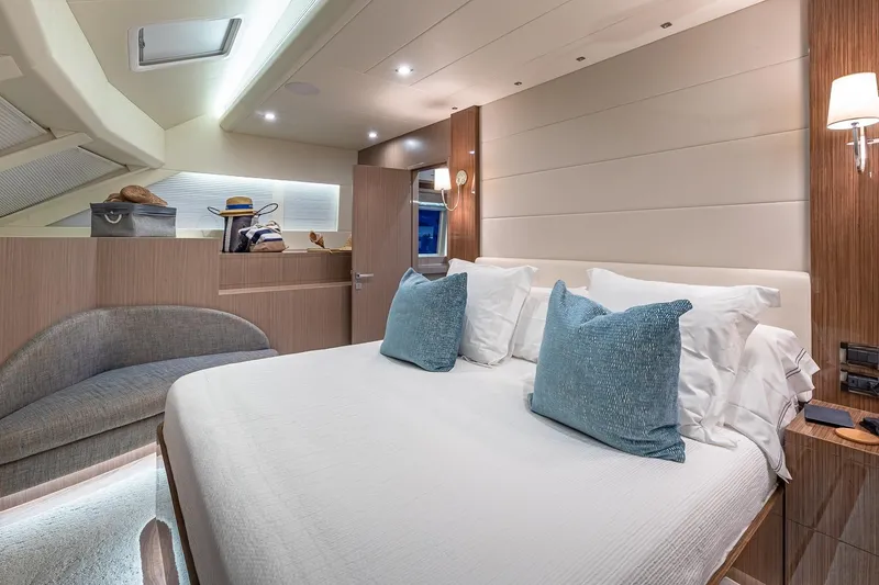 Slide: The Image of Luxurious 2023 Horizon PC60 yacht bedroom with elegant decor and plush bedding. - 9