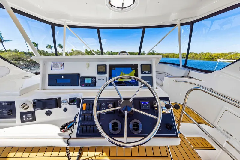 Slide: The Image of Helm of 2007 Silverton 45 Convertible yacht with navigation equipment and panoramic view. - 23