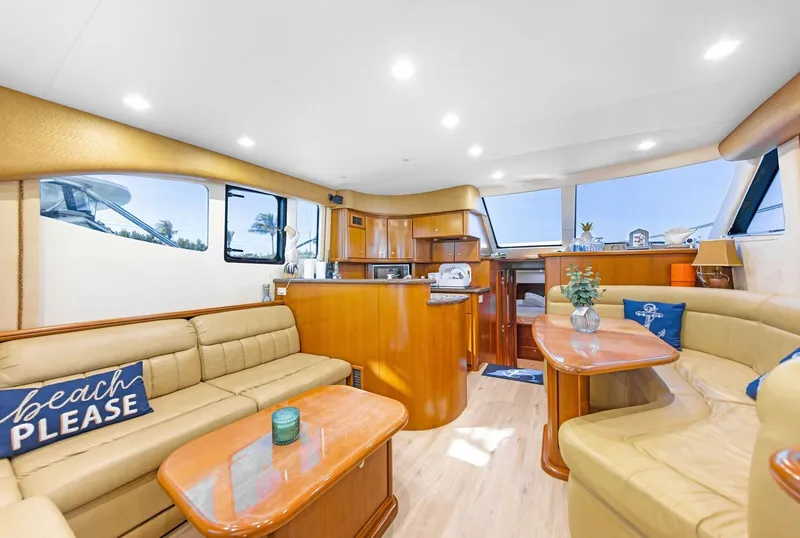 Slide: The Image of Luxurious interior of 2007 Silverton 45 Convertible yacht with elegant seating and decor. - 5