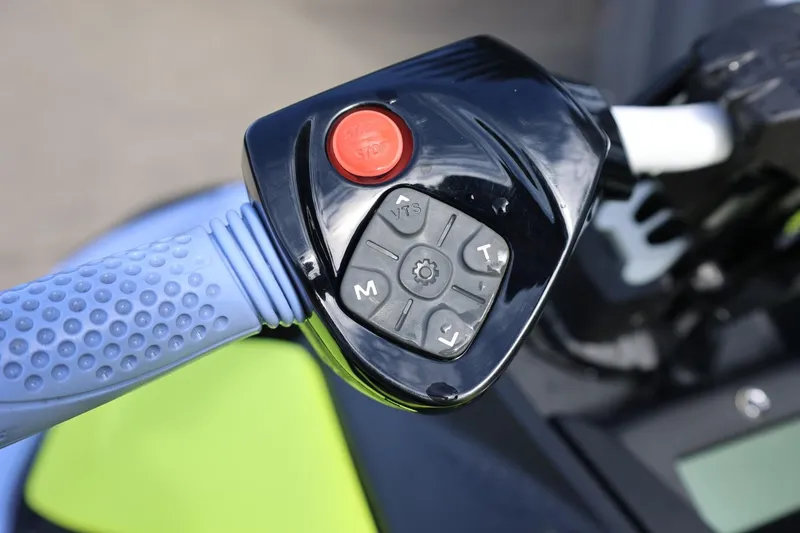 Slide: The Image of 2024 Sea-Doo Spark Trixx handlebar controls with start/stop button and grip detail. - 12