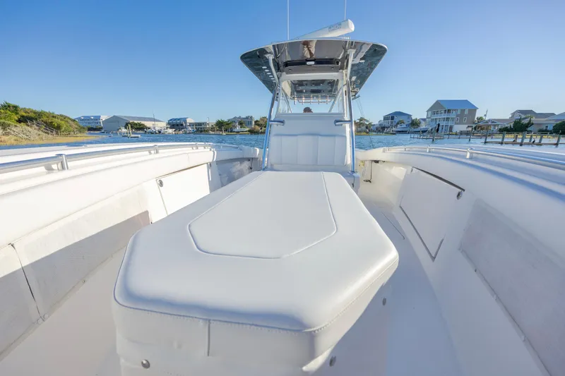 Slide: The Image of Control panel of 2015 Invincible 39 Open Fisherman with navigation screens and steering wheel. - 16