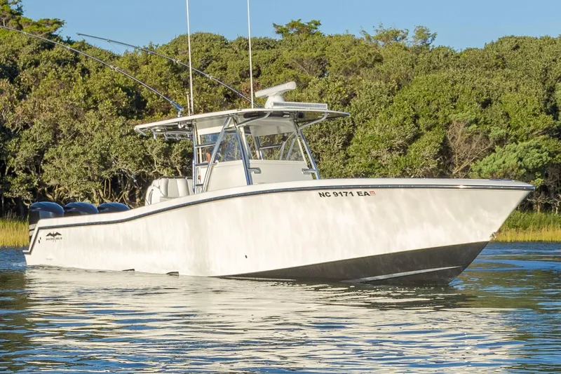 Slide: The Image of 2015 Invincible 39 Open Fisherman boat cruising on a sunny day. - 7